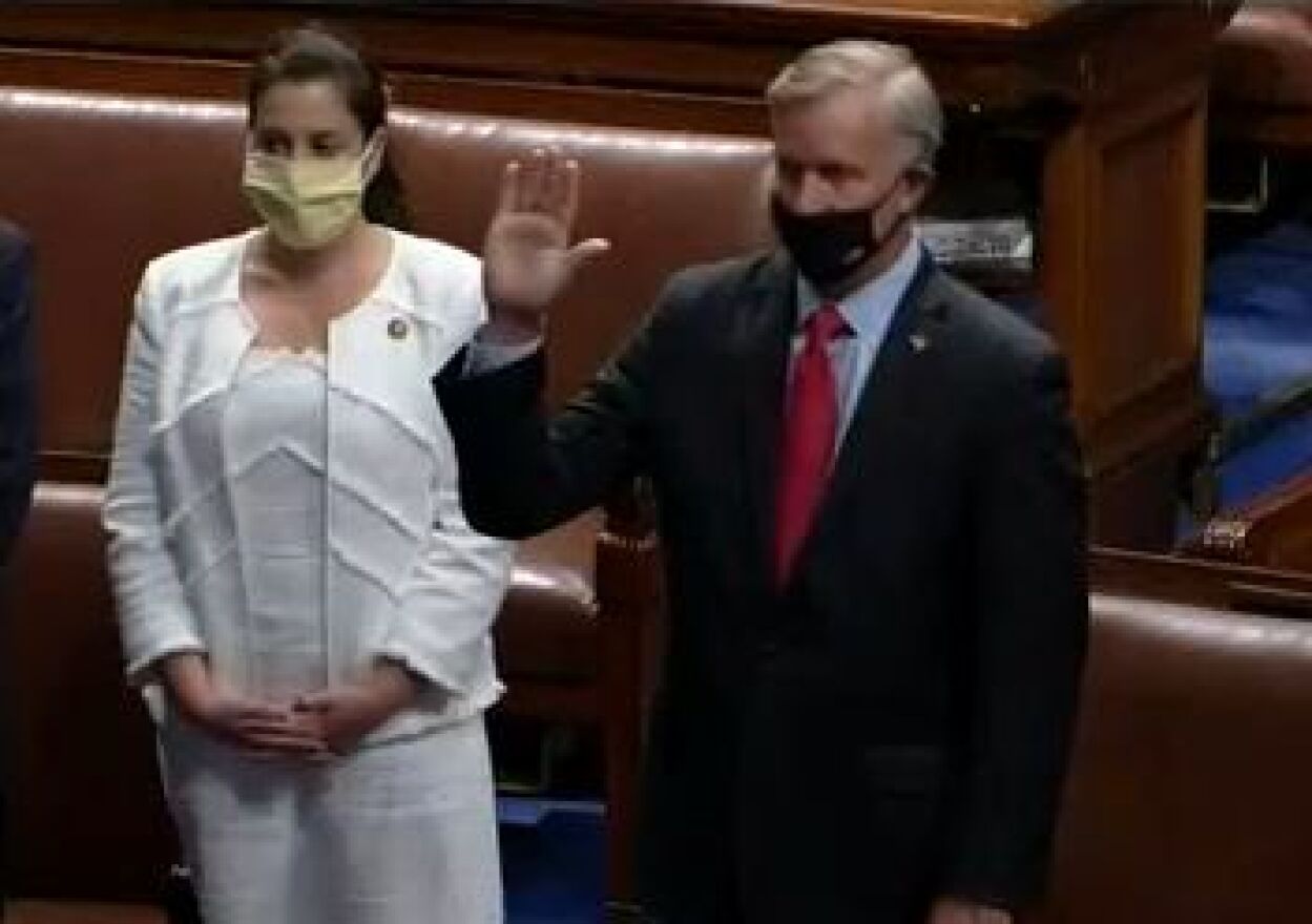Chris Jacobs, taking the oath of office Tuesday in the House of Representatives, with his wife Martina.